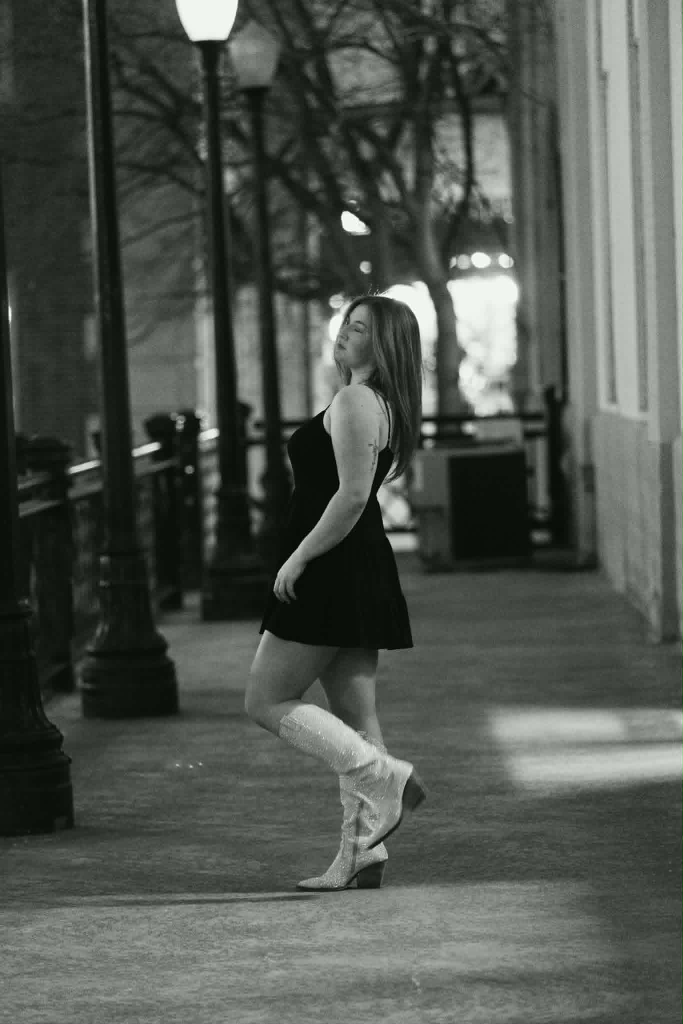 Black-and-white sidewalk portrait of Briella Steiner